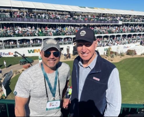 Jonathan Rotella, CEO of NexGen Hyperbaric, and Jerry Rosburg, football coach, pose for a photo.